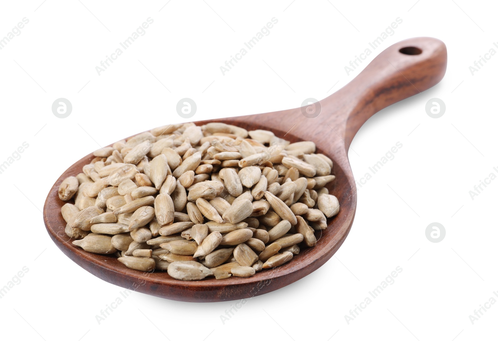 Photo of Peeled sunflower seeds in wooden spoon isolated on white