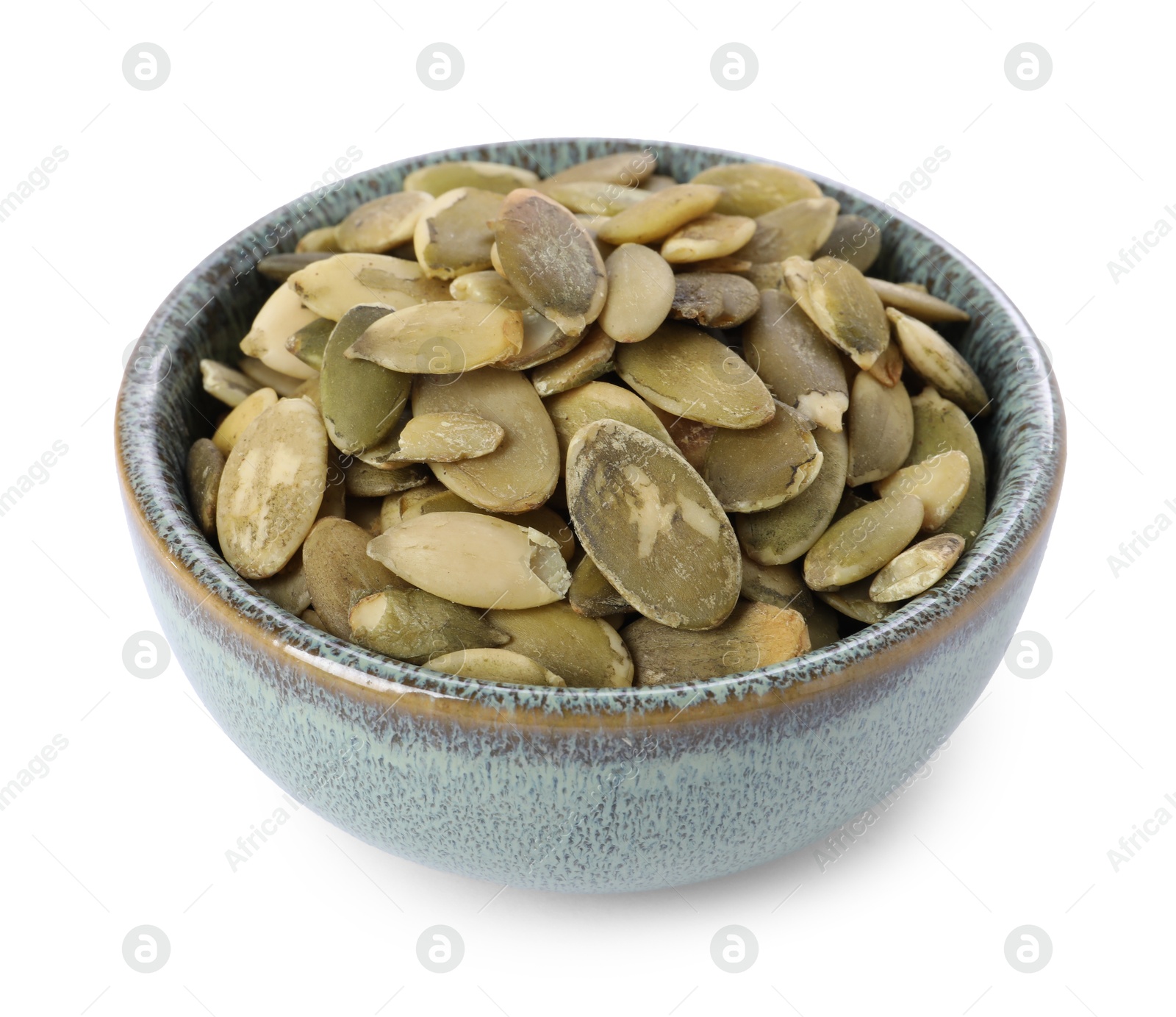 Photo of Peeled pumpkin seeds in bowl isolated on white