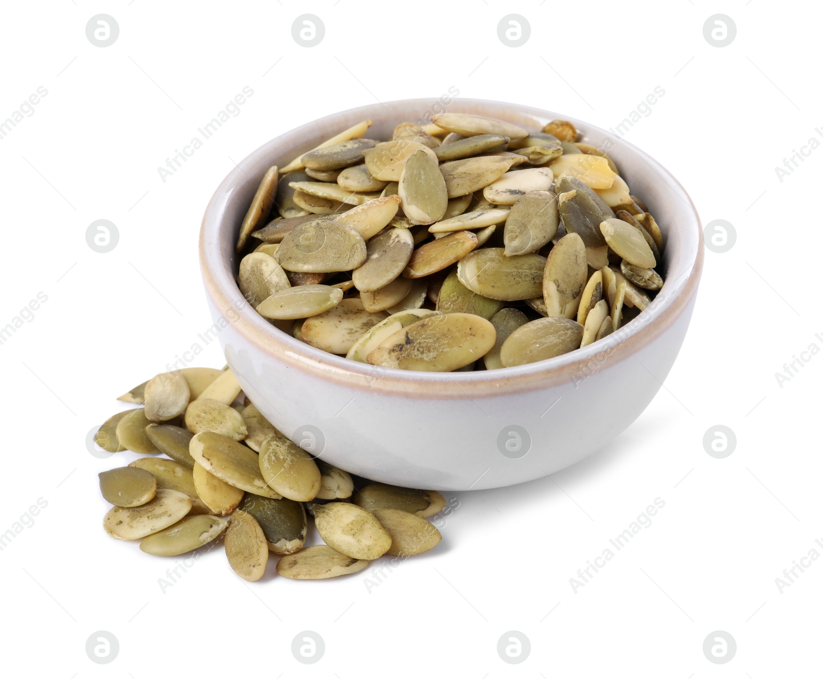 Photo of Peeled pumpkin seeds in bowl isolated on white