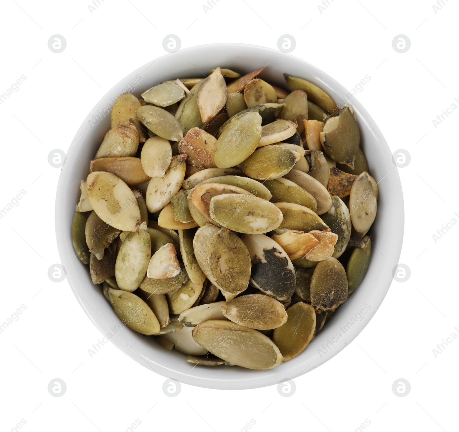 Photo of Peeled pumpkin seeds in bowl isolated on white, top view