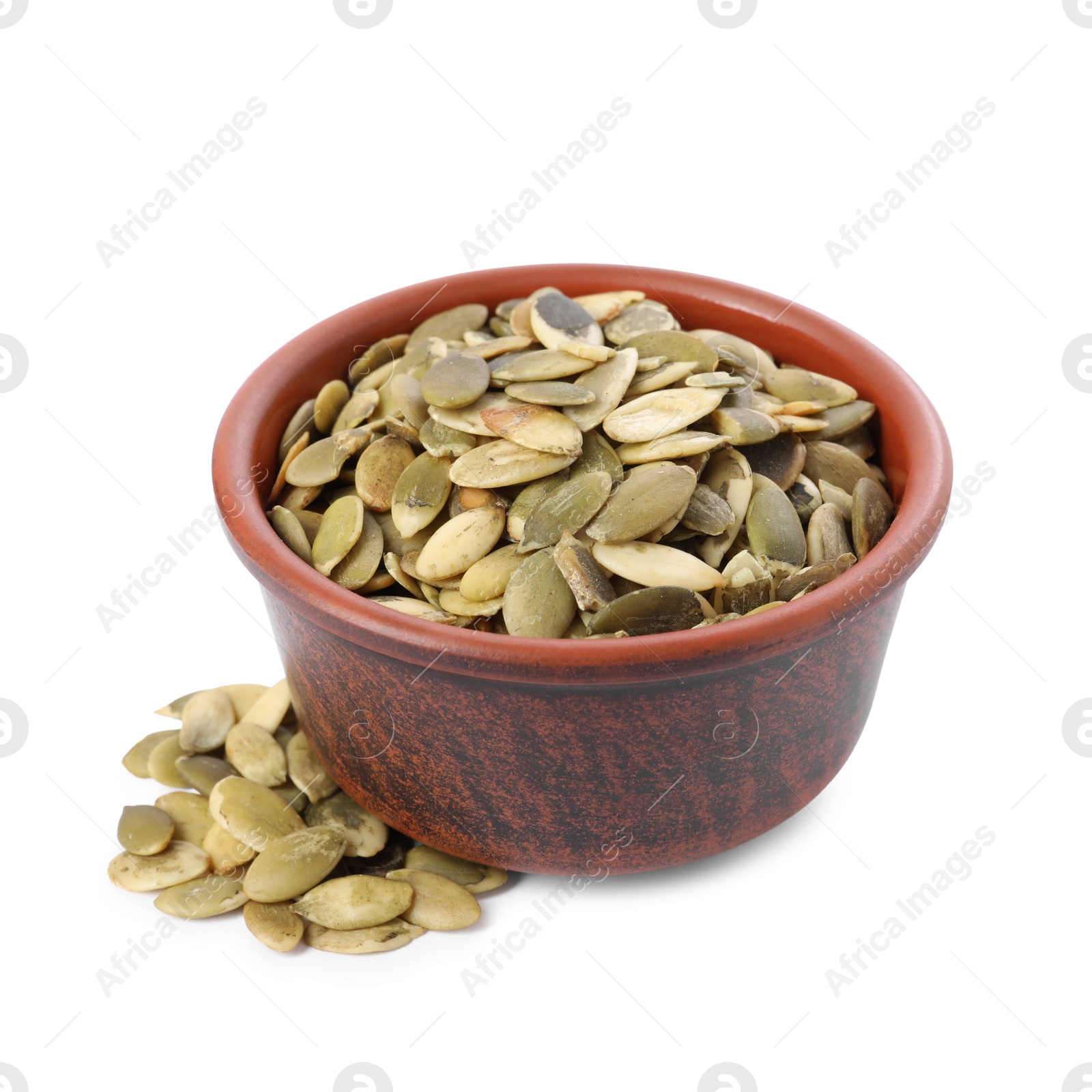 Photo of Peeled pumpkin seeds in bowl isolated on white