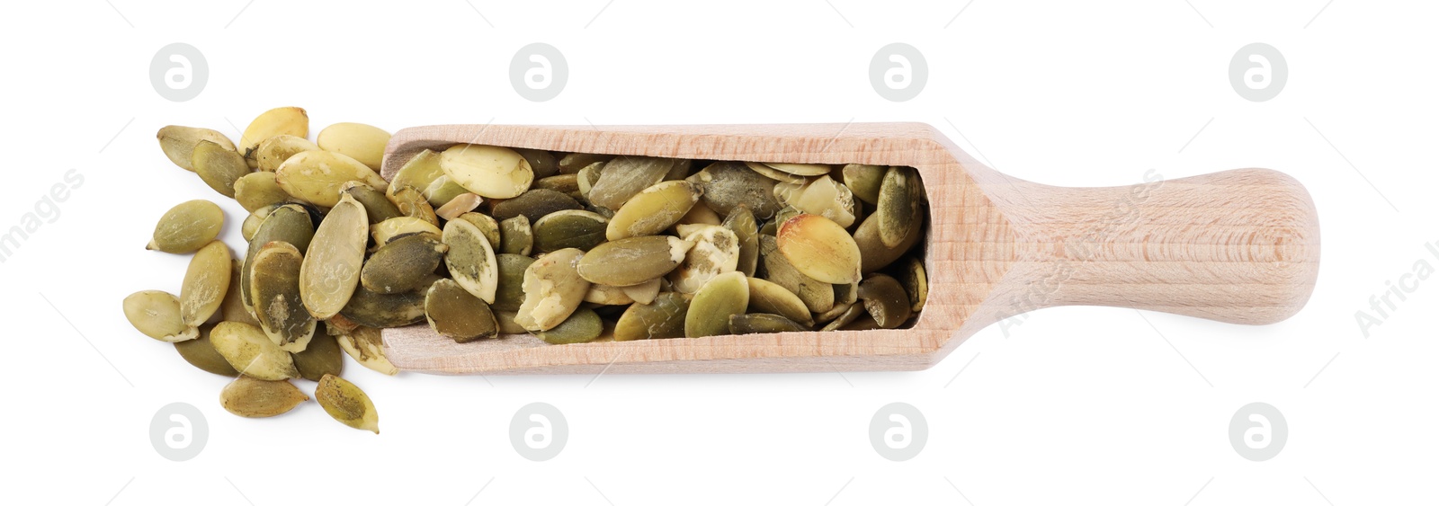 Photo of Peeled pumpkin seeds in wooden scoop isolated on white, top view