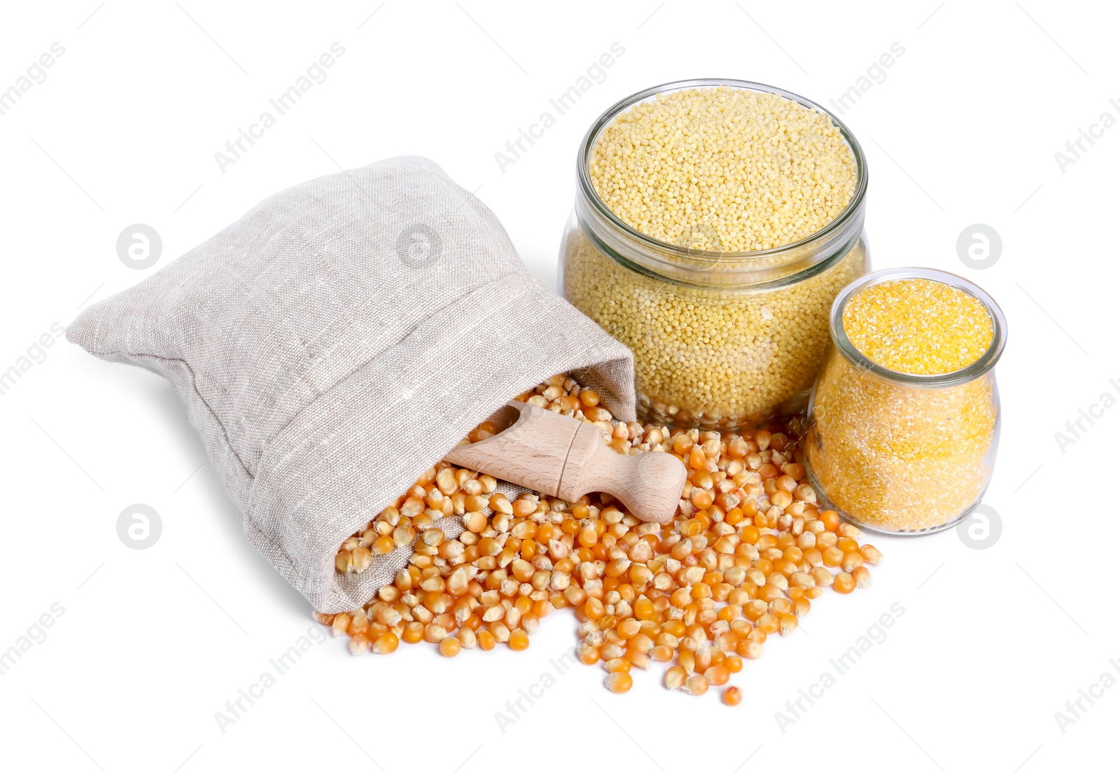 Photo of Corn kernels, millet groats and cornmeal isolated on white