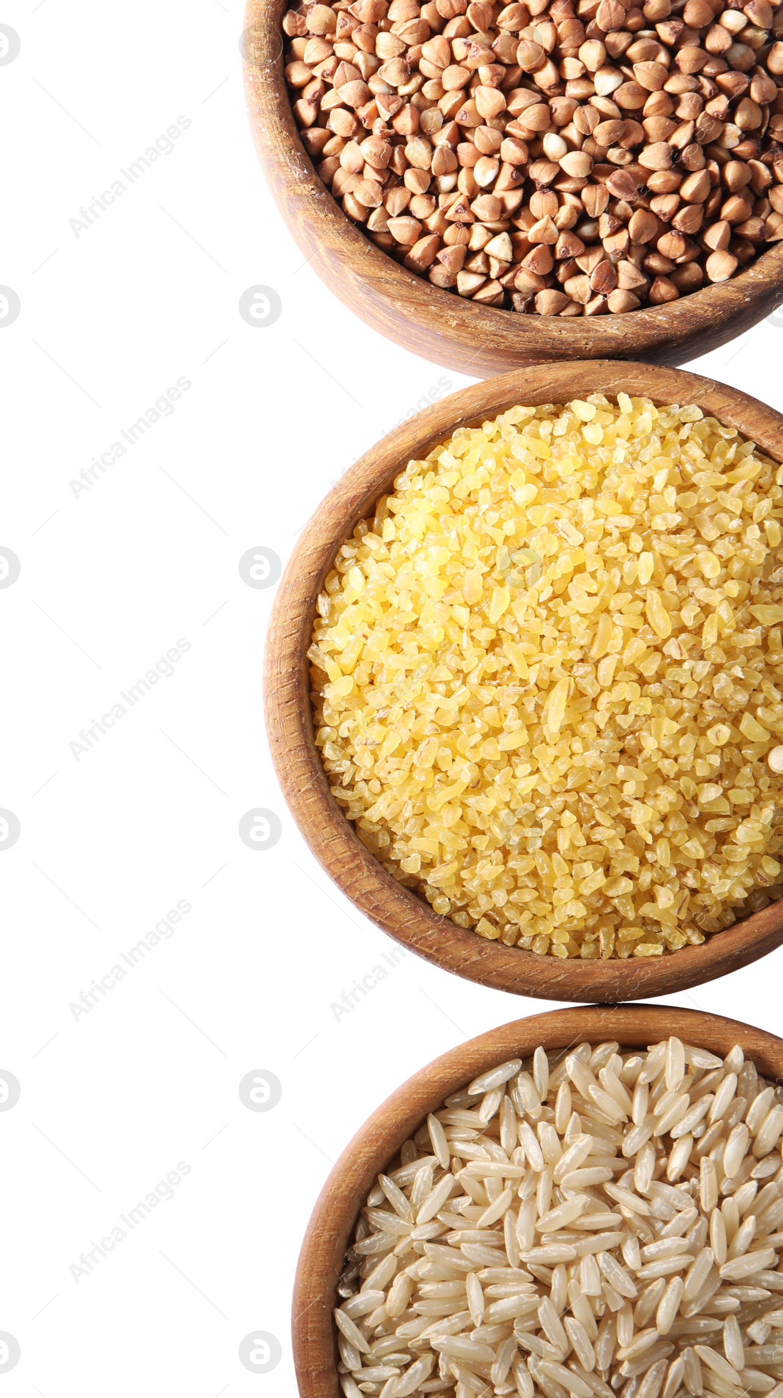 Photo of Different types of cereals in bowls isolated on white, top view