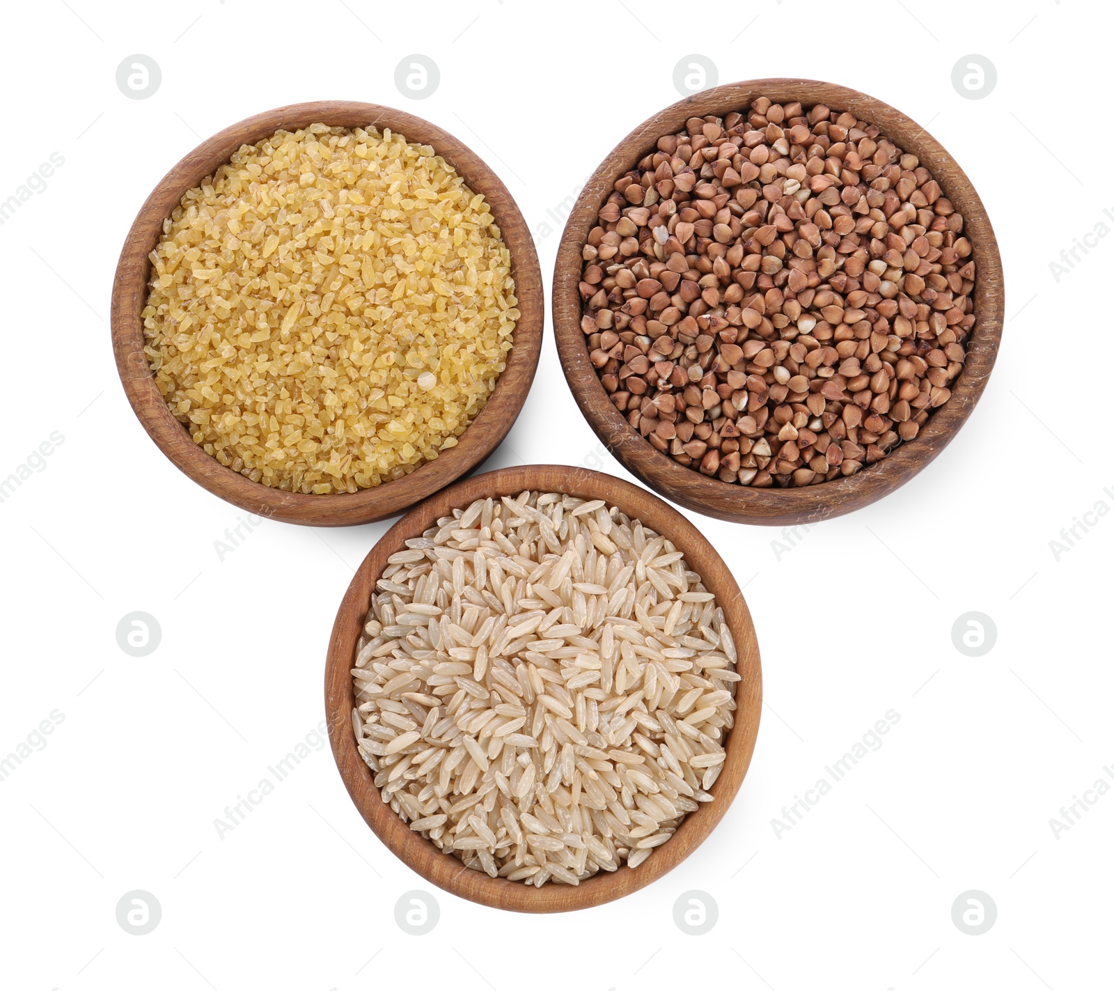 Photo of Different types of cereals in bowls isolated on white, top view