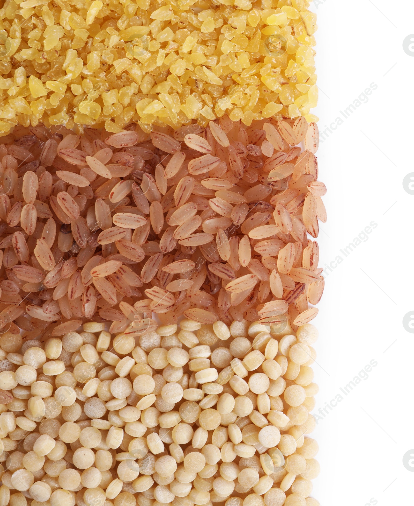 Photo of Different types of cereals isolated on white, top view