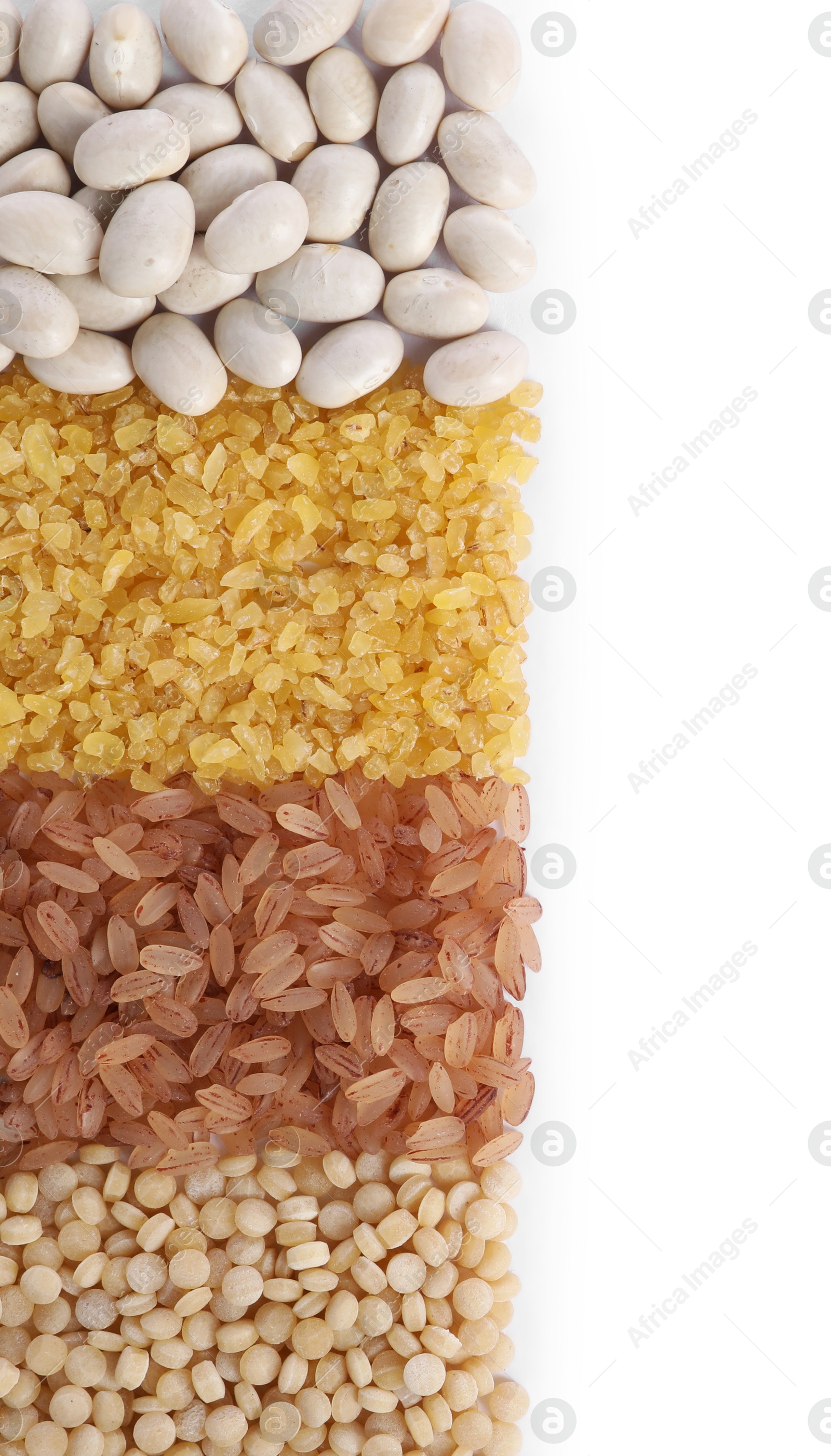 Photo of Different types of cereals and legumes isolated on white, top view