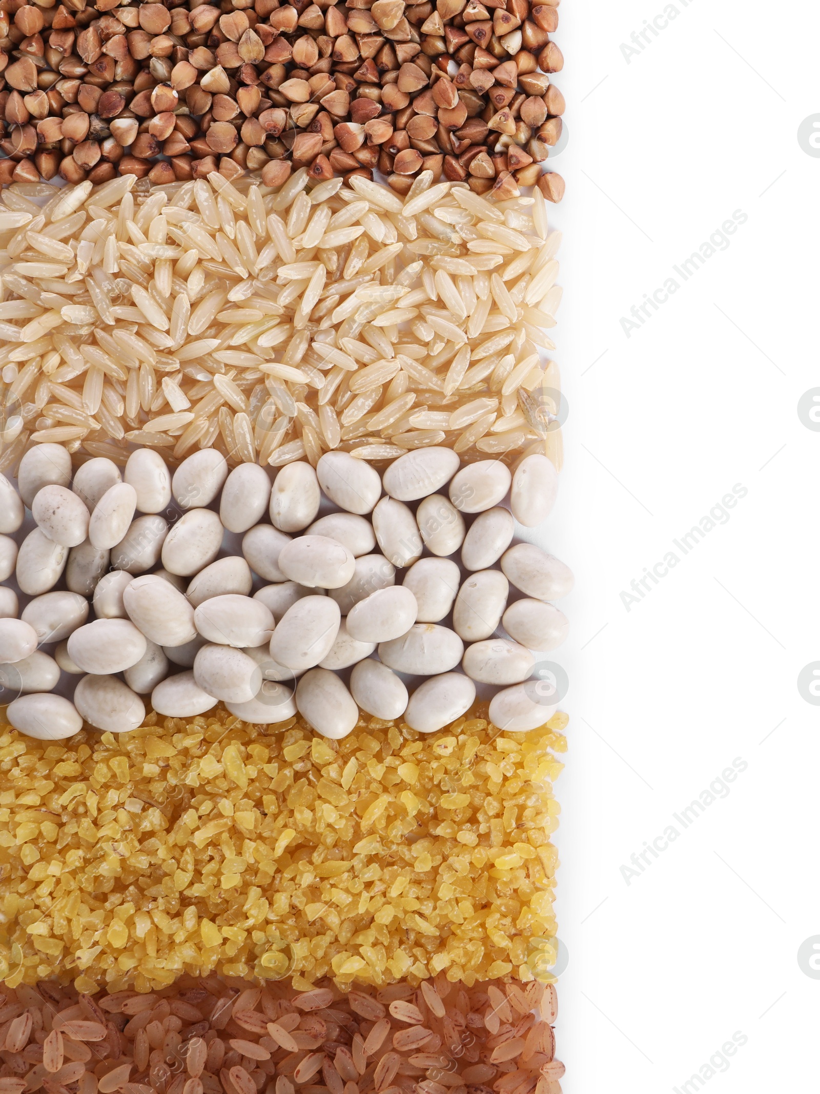 Photo of Different types of cereals and legumes isolated on white, top view