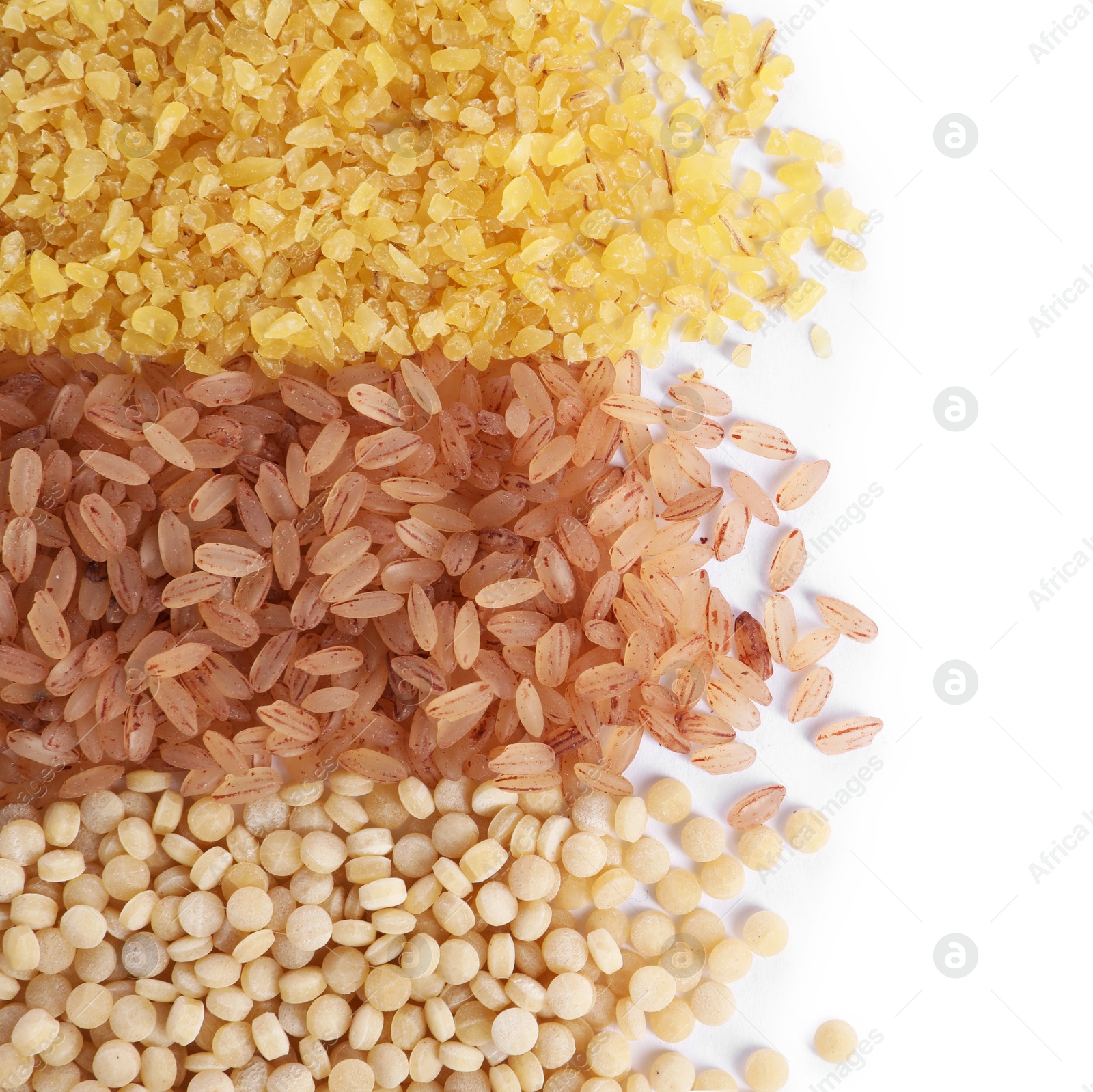 Photo of Different types of cereals isolated on white, top view