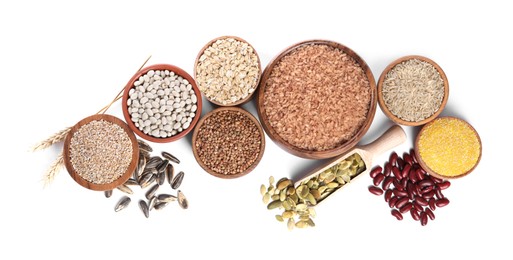 Photo of Different types of cereals, legumes and seeds isolated on white, top view