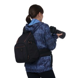 Photographer with backpack and camera on white background