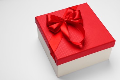 Photo of Gift box with bow on light grey background