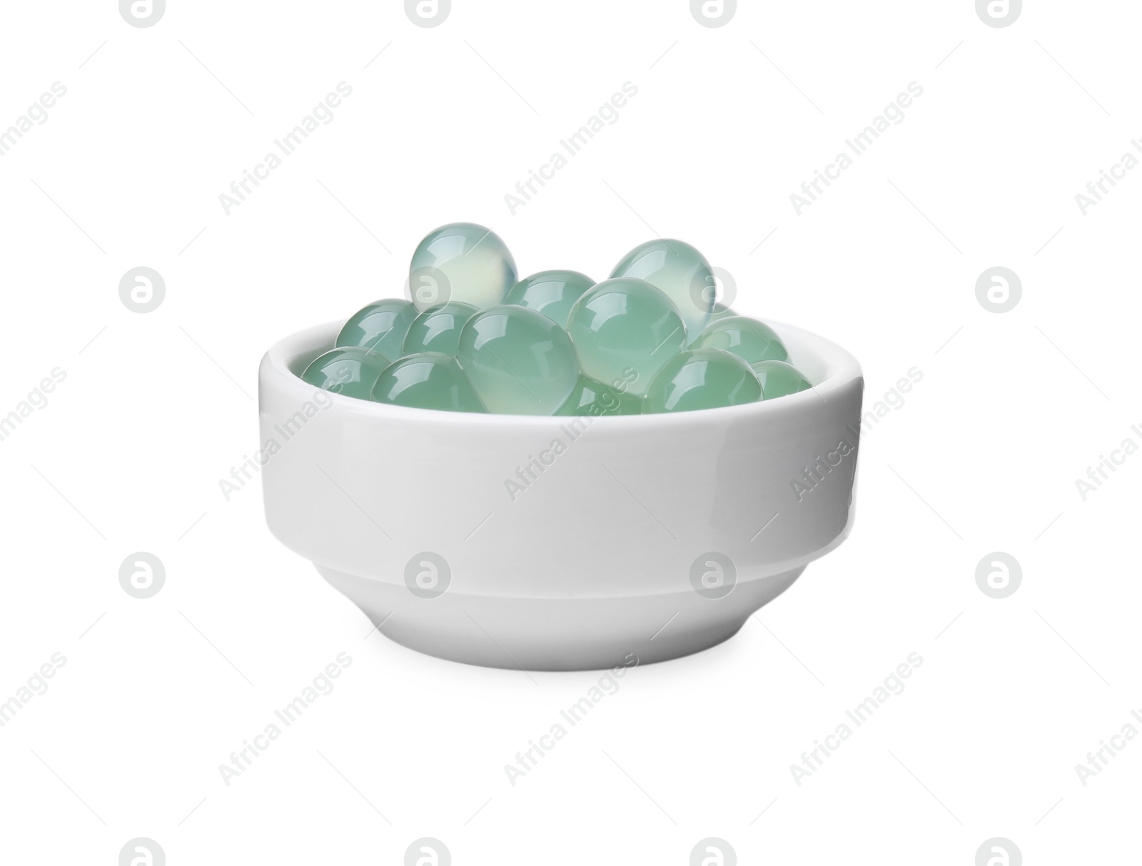 Photo of Bright tapioca pearls in bowl isolated on white