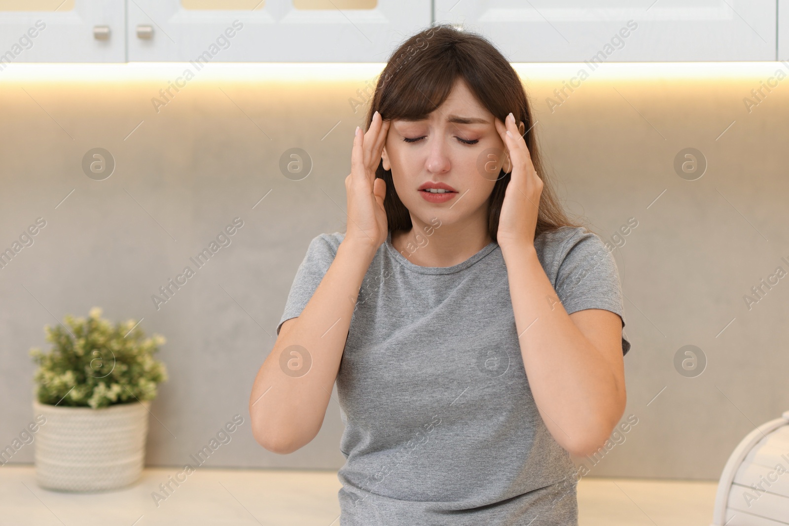 Photo of Tired woman suffering from sinusitis at home