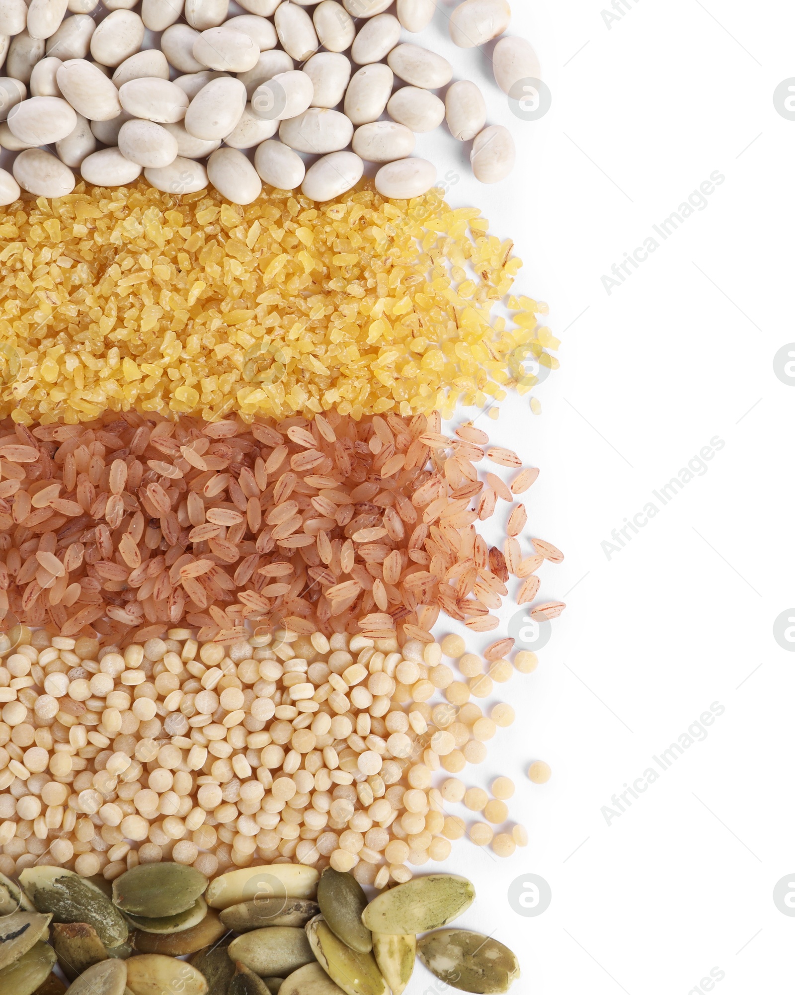 Photo of Different types of cereals, legumes and seeds isolated on white, top view