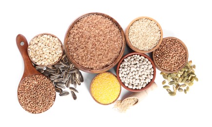 Photo of Different types of cereals, legumes and seeds isolated on white, top view