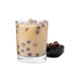 Photo of Tasty milk bubble tea in glass and tapioca pearls isolated on white