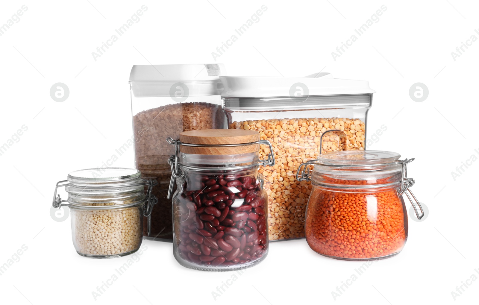 Photo of Different types of cereals and legumes in containers isolated on white