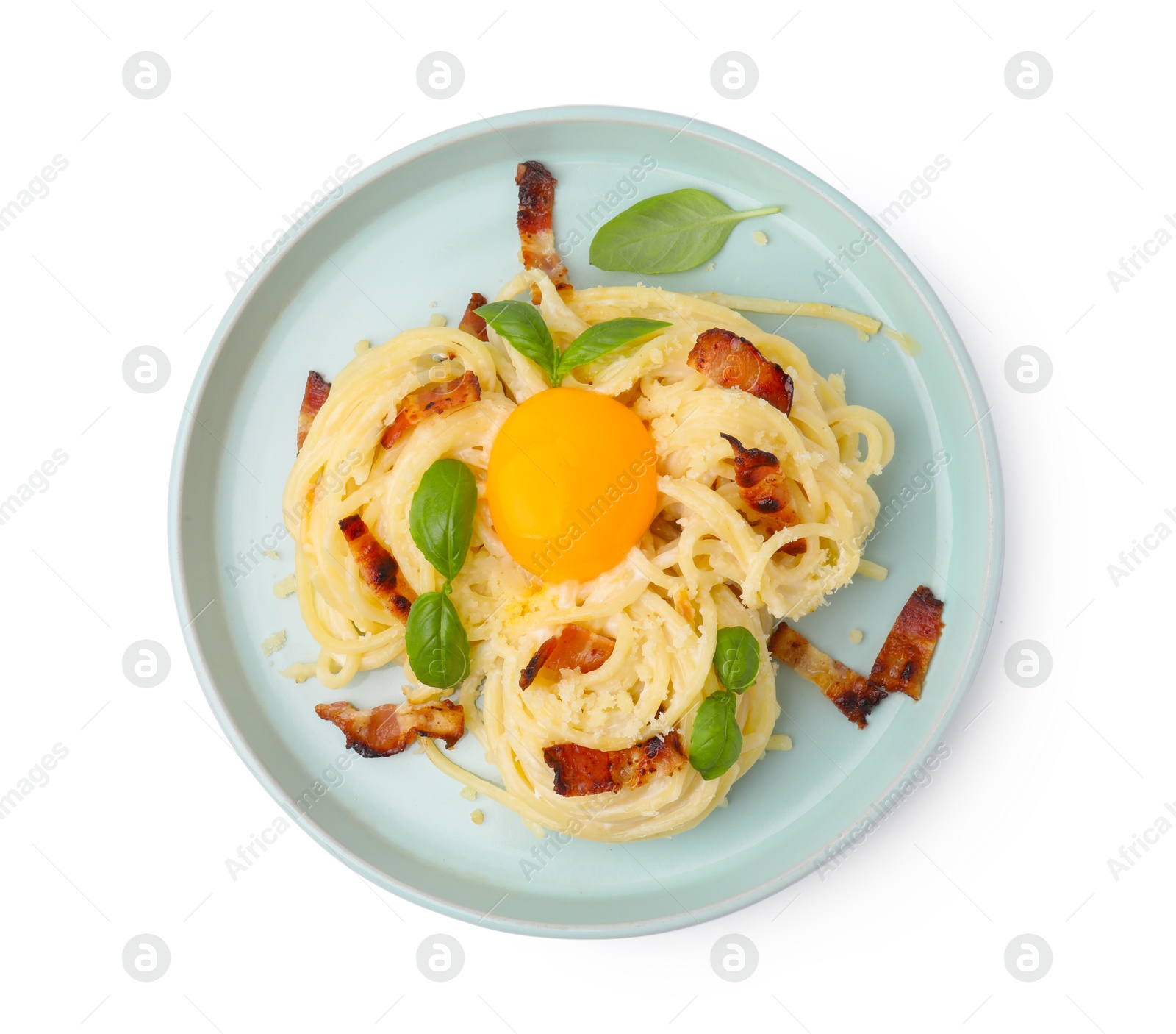 Photo of Delicious pasta Carbonara with egg yolk, bacon and basil isolated on white, top view