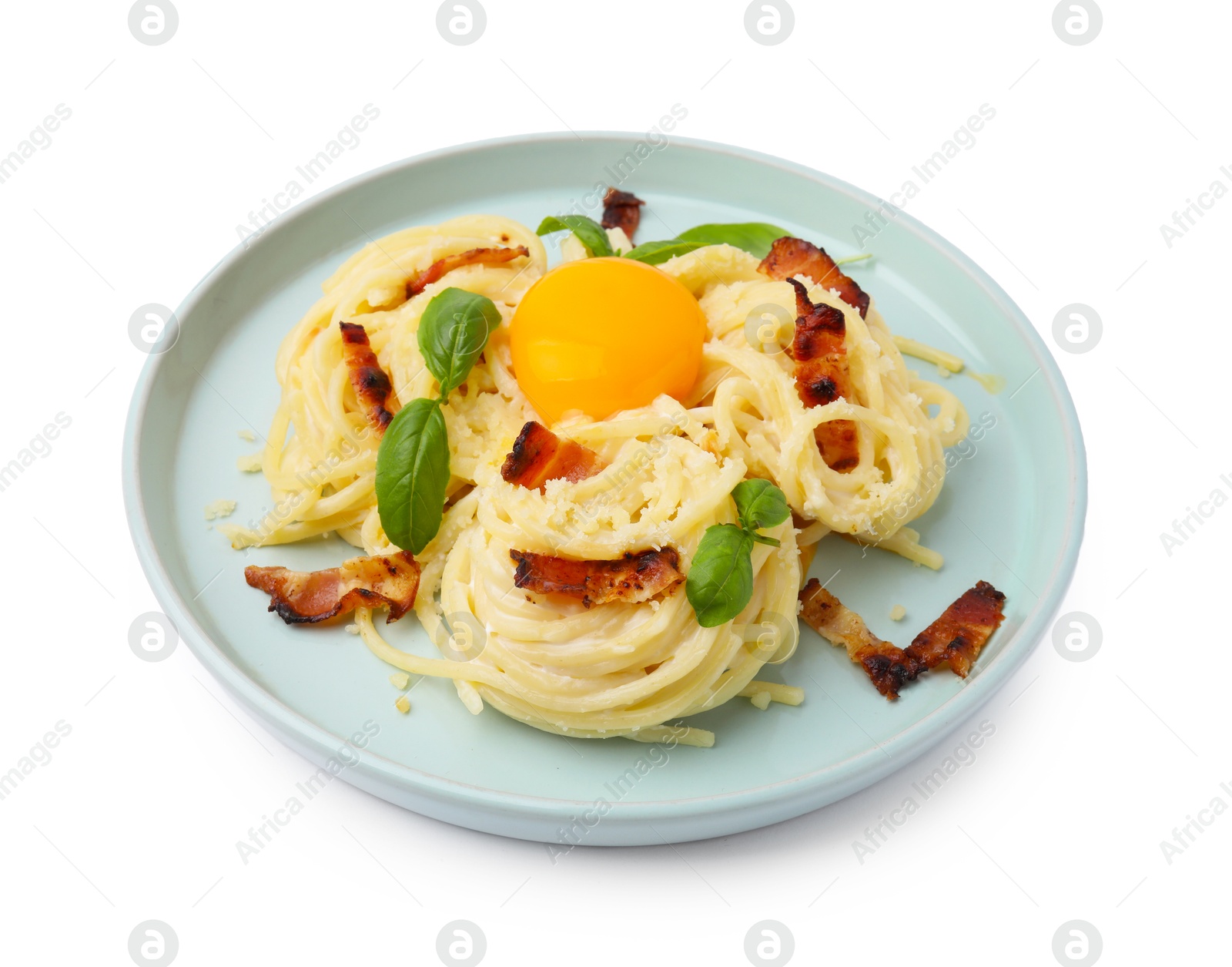 Photo of Delicious pasta Carbonara with egg yolk, bacon and basil isolated on white