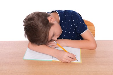 Boy with incorrect posture and notebook at wooden desk on white background