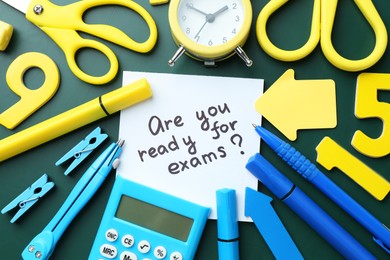 Note with question Are You Ready For Exams and stationery on green background, flat lay