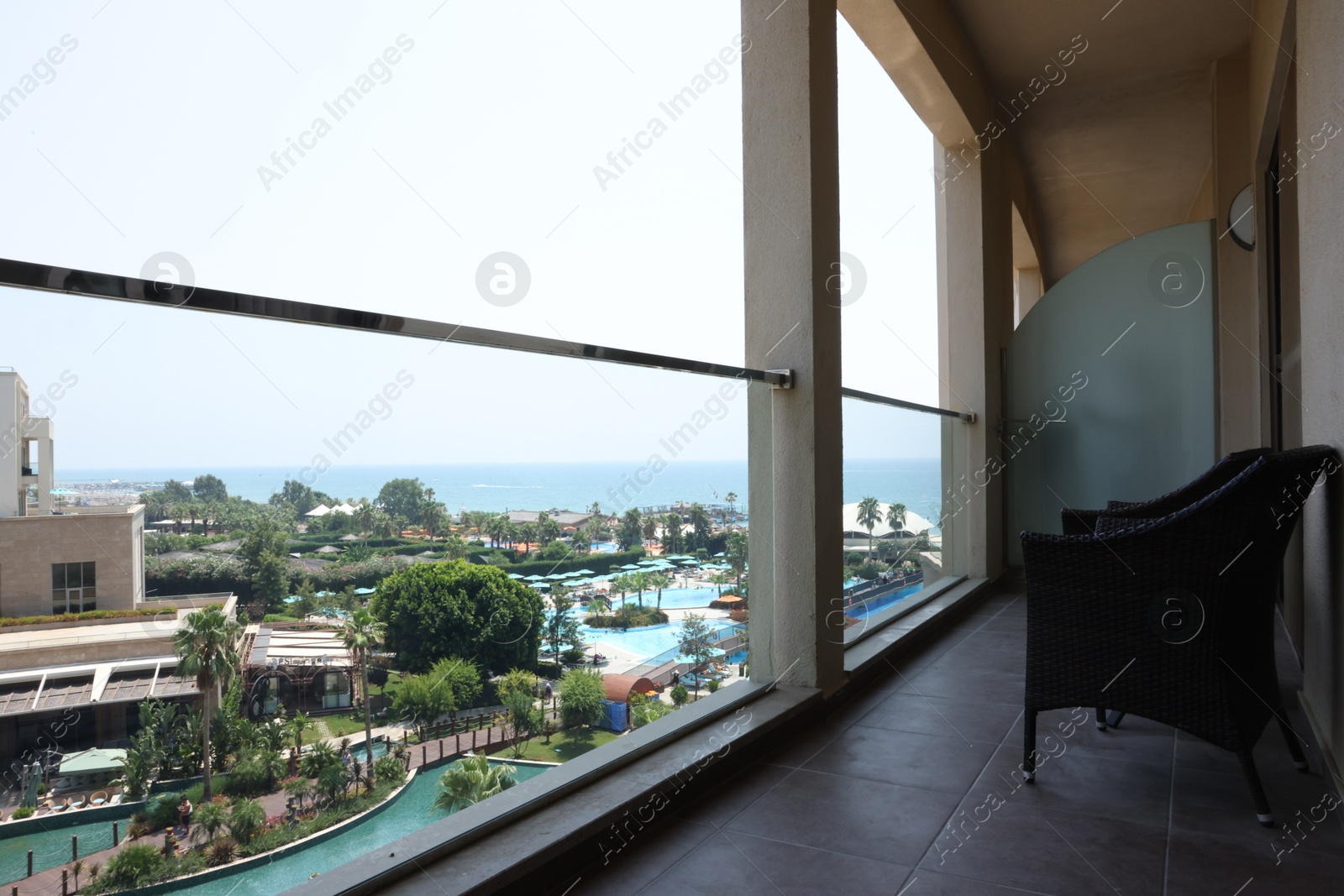 Photo of Belek, Turkey - July 25, 2024: Rattan chairs on hotel balcony at Kaya Palazzo Golf Resort