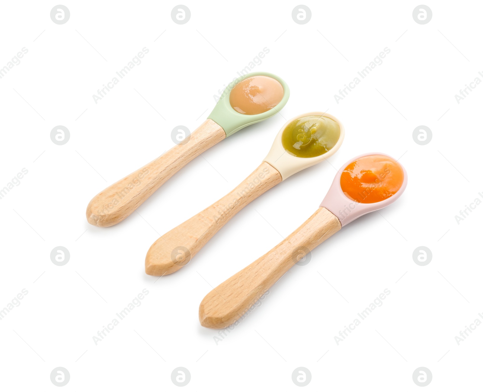 Photo of Spoons with different baby food isolated on white