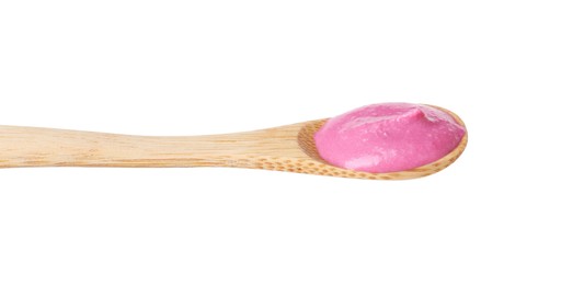 Photo of Tasty beetroot hummus in wooden spoon isolated on white