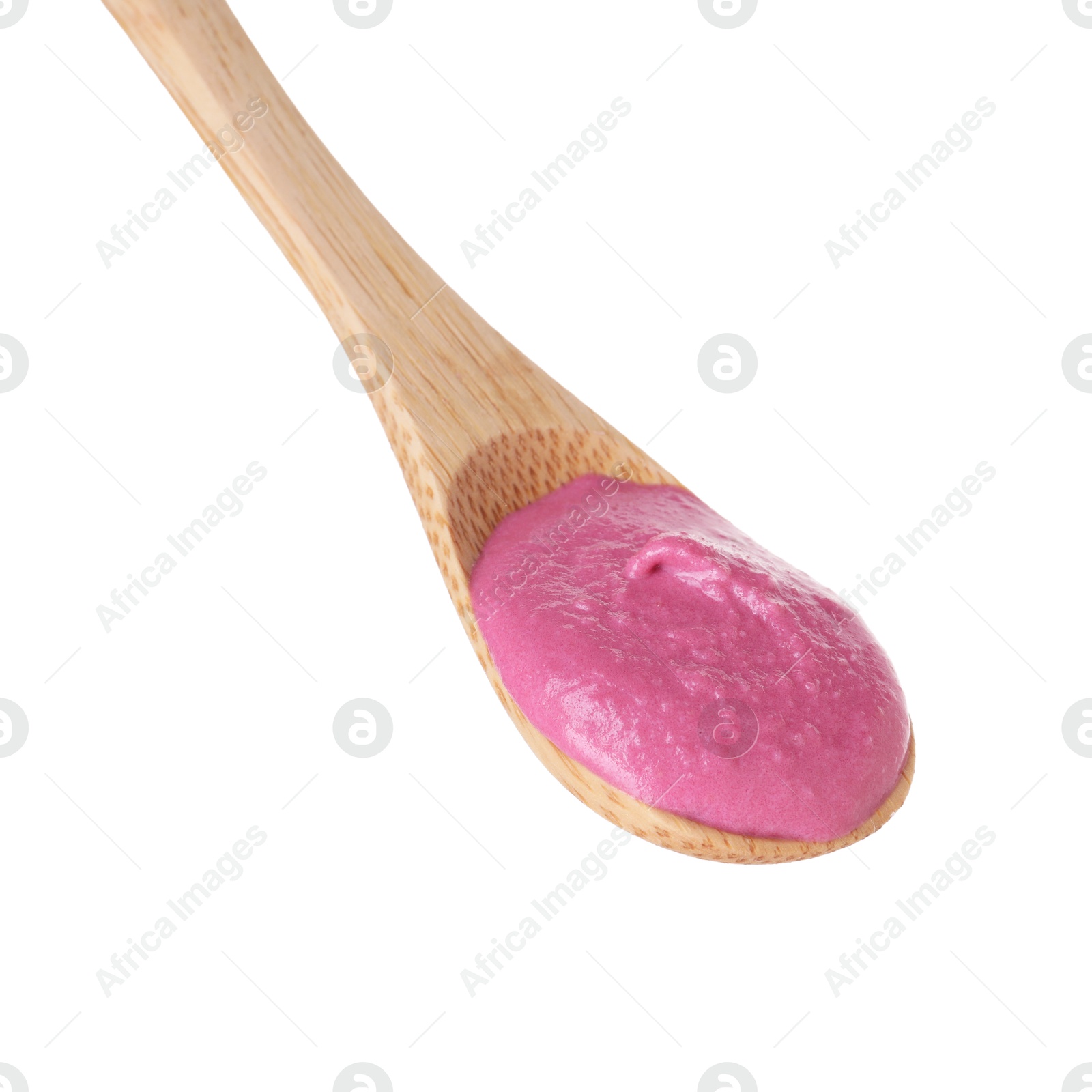 Photo of Tasty beetroot hummus in wooden spoon isolated on white