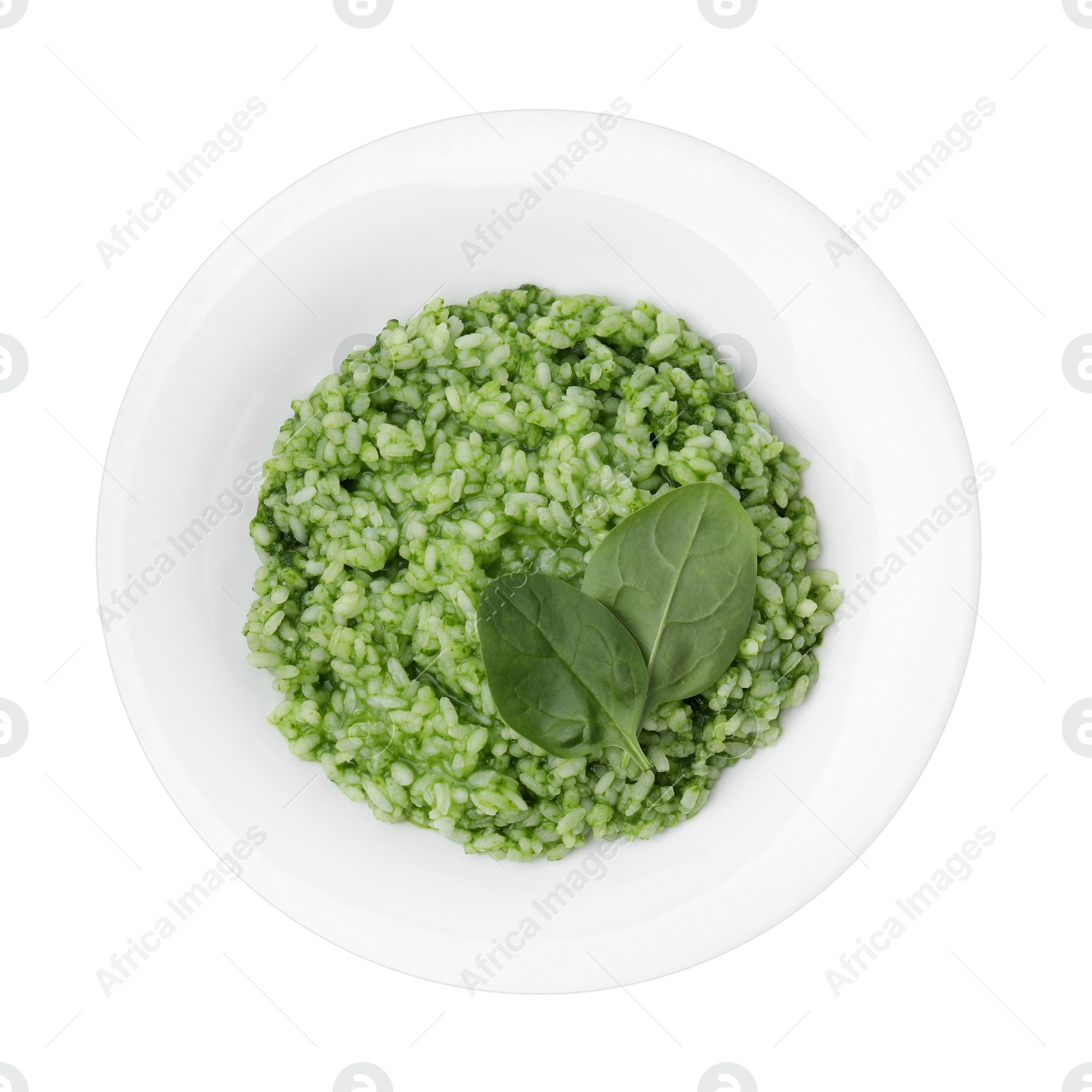 Photo of Delicious spinach risotto isolated on white, top view