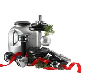 Photo of Dumbbells, container with supplement and Christmas decor isolated on white