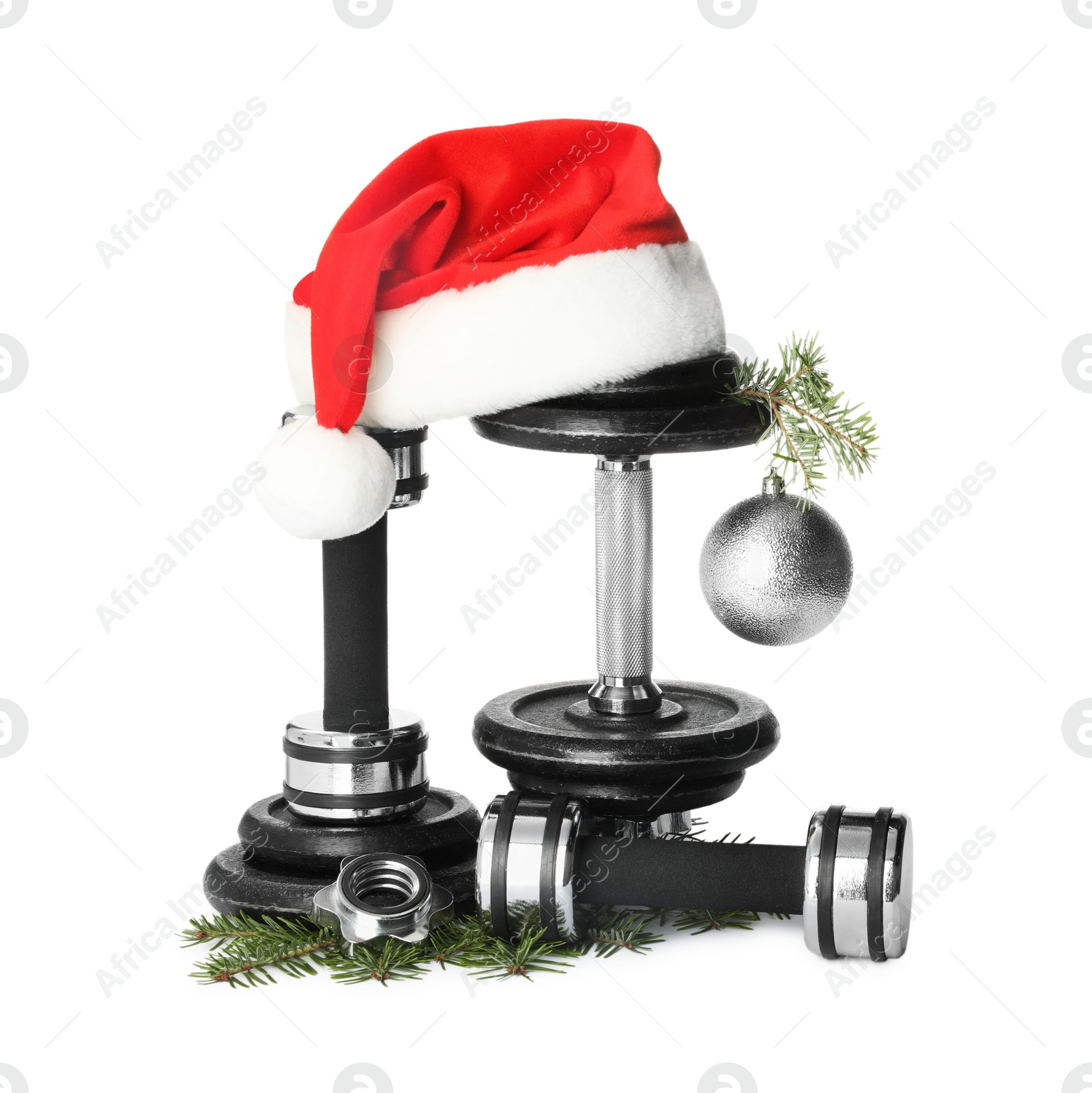 Photo of Dumbbells and Christmas decor isolated on white