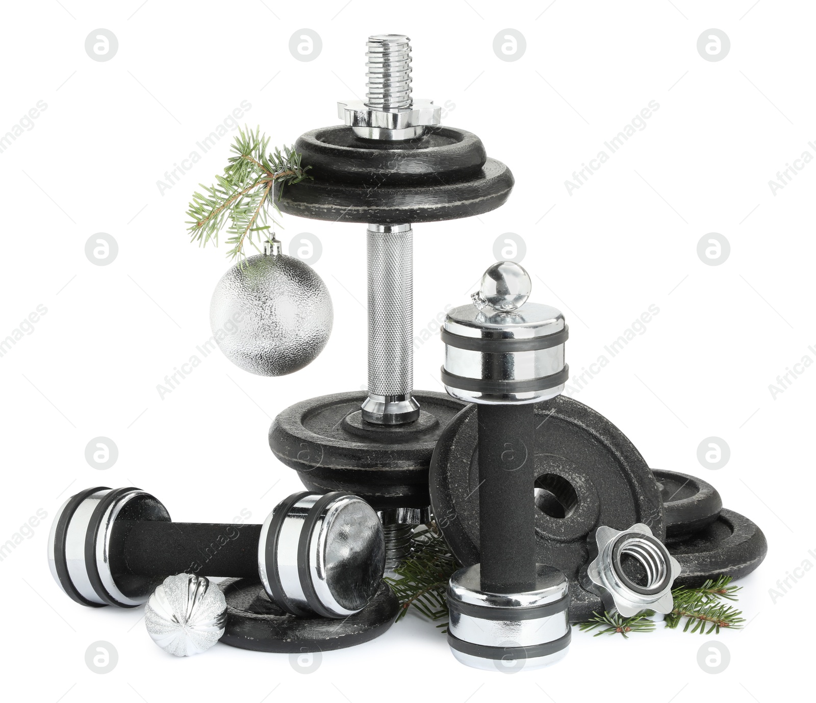 Photo of Dumbbells and Christmas decor isolated on white