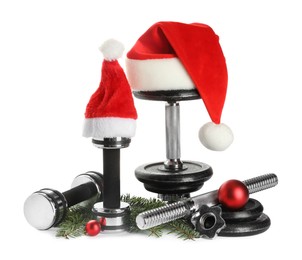 Photo of Dumbbells and Christmas decor isolated on white