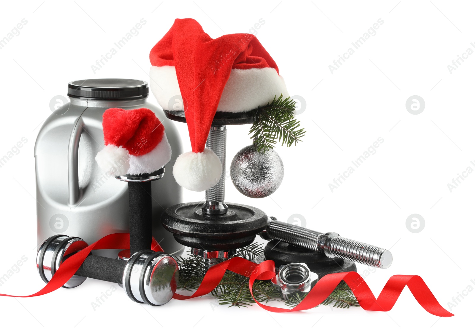 Photo of Dumbbells, container with supplement and Christmas decor isolated on white