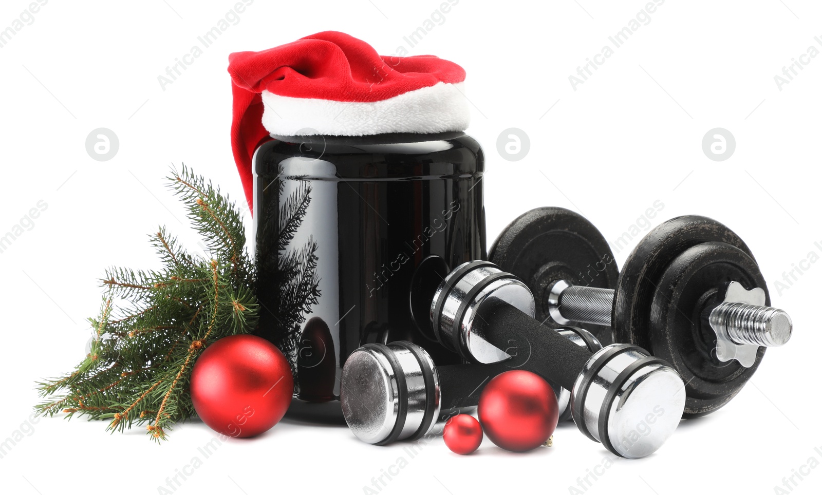 Photo of Dumbbells, container with supplement and Christmas decor isolated on white