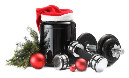 Photo of Dumbbells, container with supplement and Christmas decor isolated on white