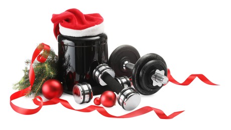 Photo of Dumbbells, container with supplement and Christmas decor isolated on white