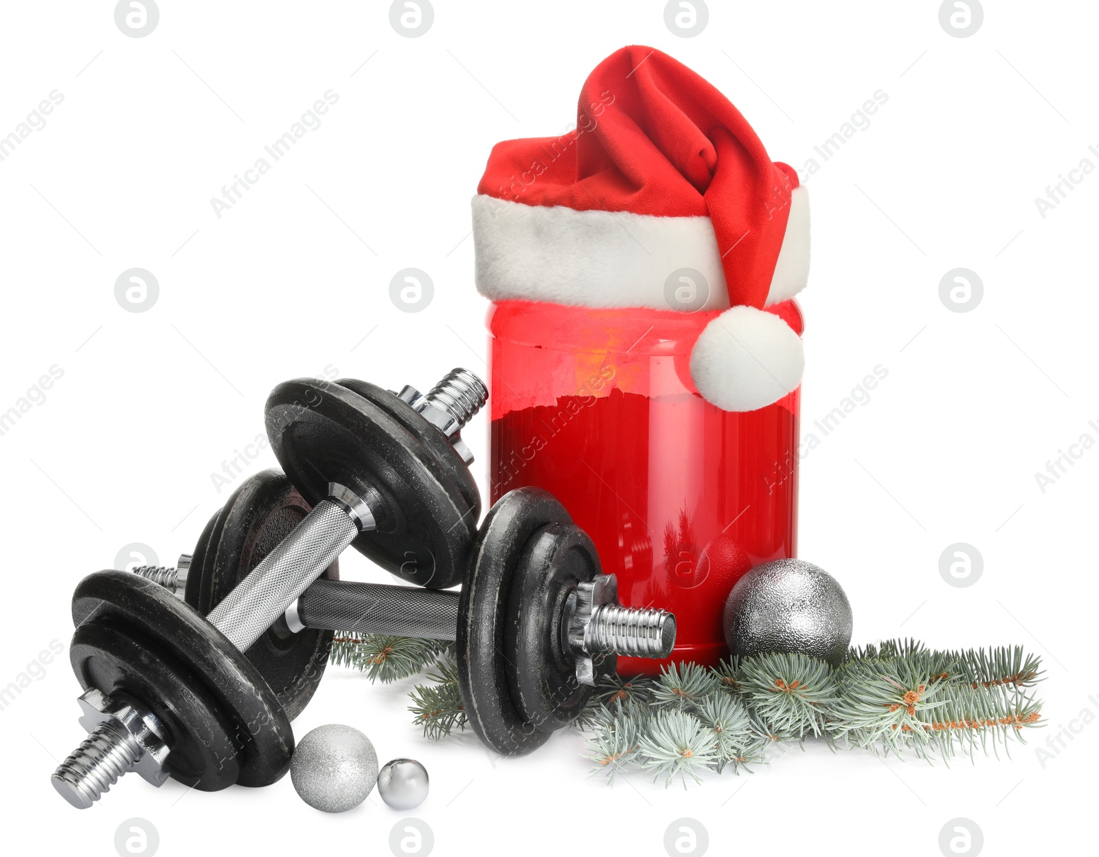 Photo of Dumbbells, container with supplement and Christmas decor isolated on white