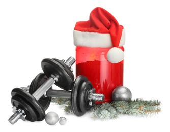 Photo of Dumbbells, container with supplement and Christmas decor isolated on white