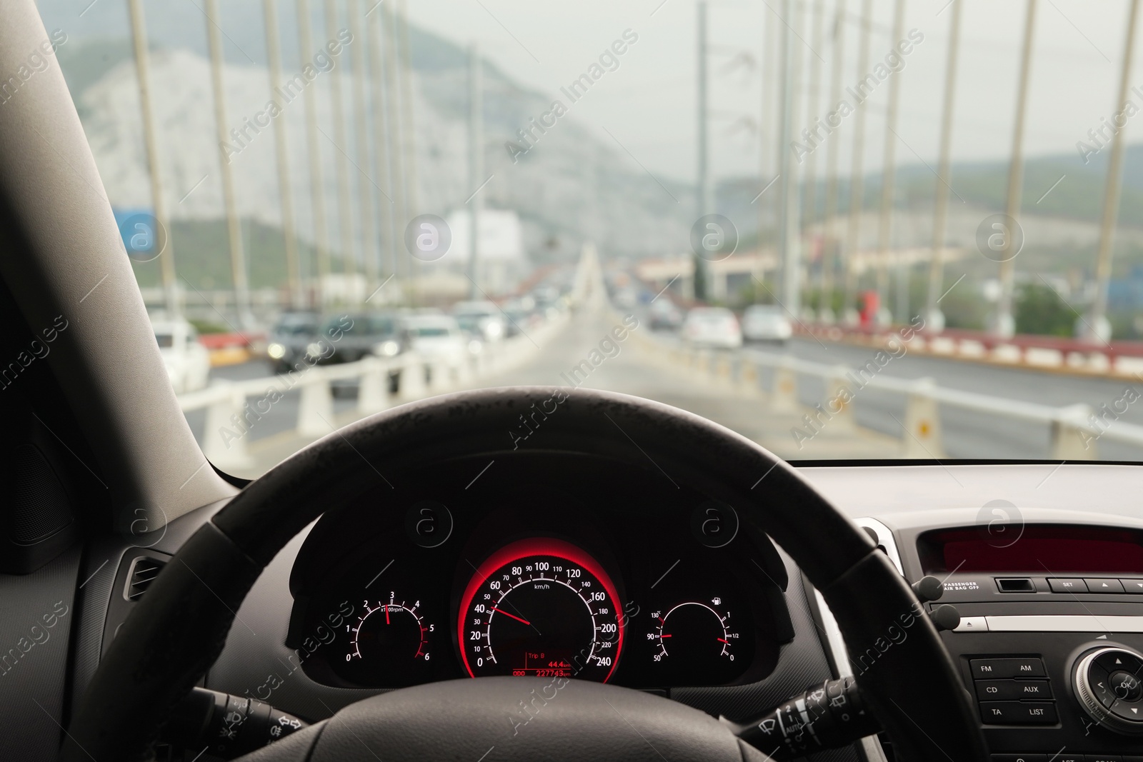 Image of Car driving on bridge, view from driver's seat