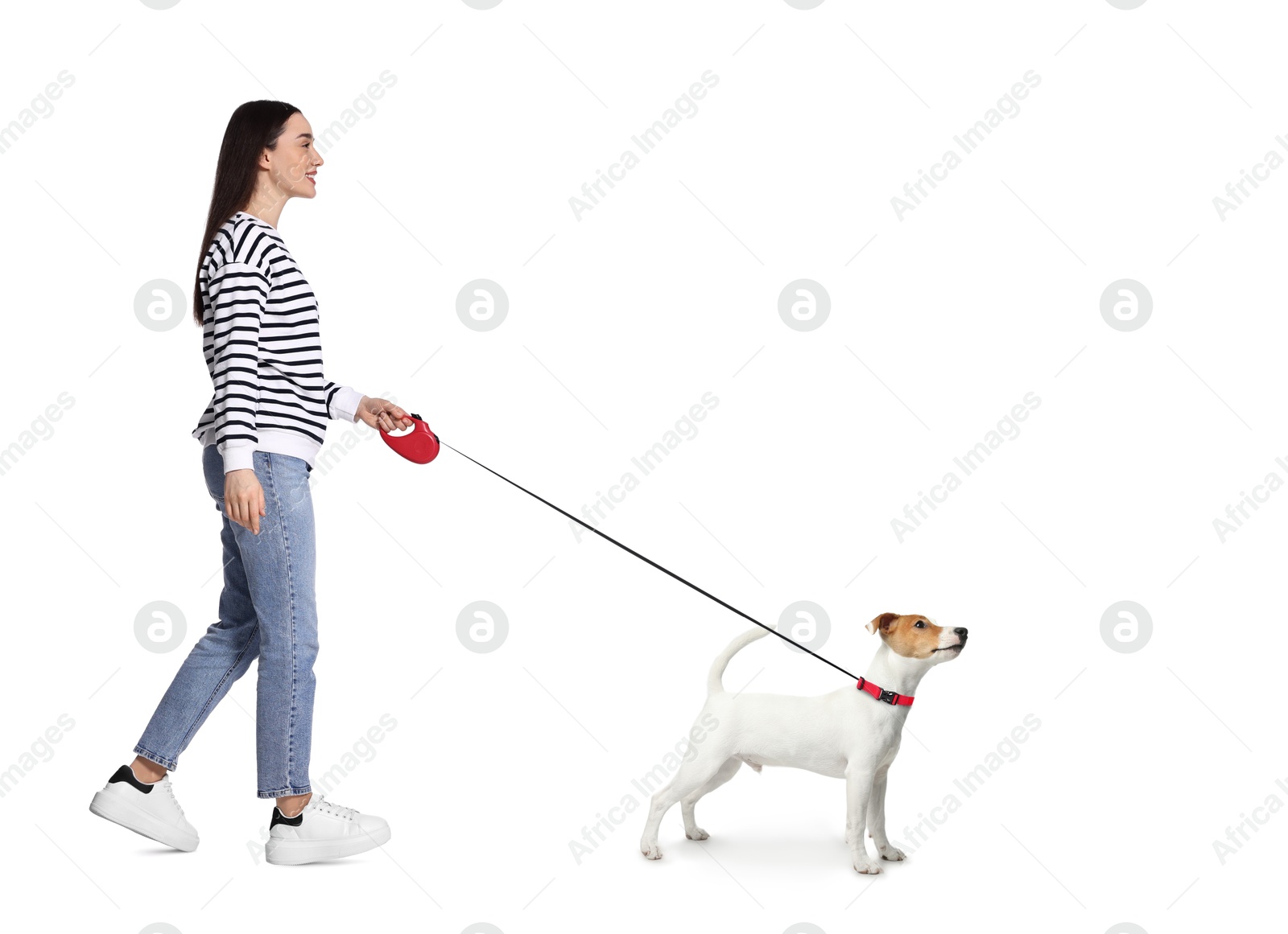 Image of Young woman walking her dog on white background