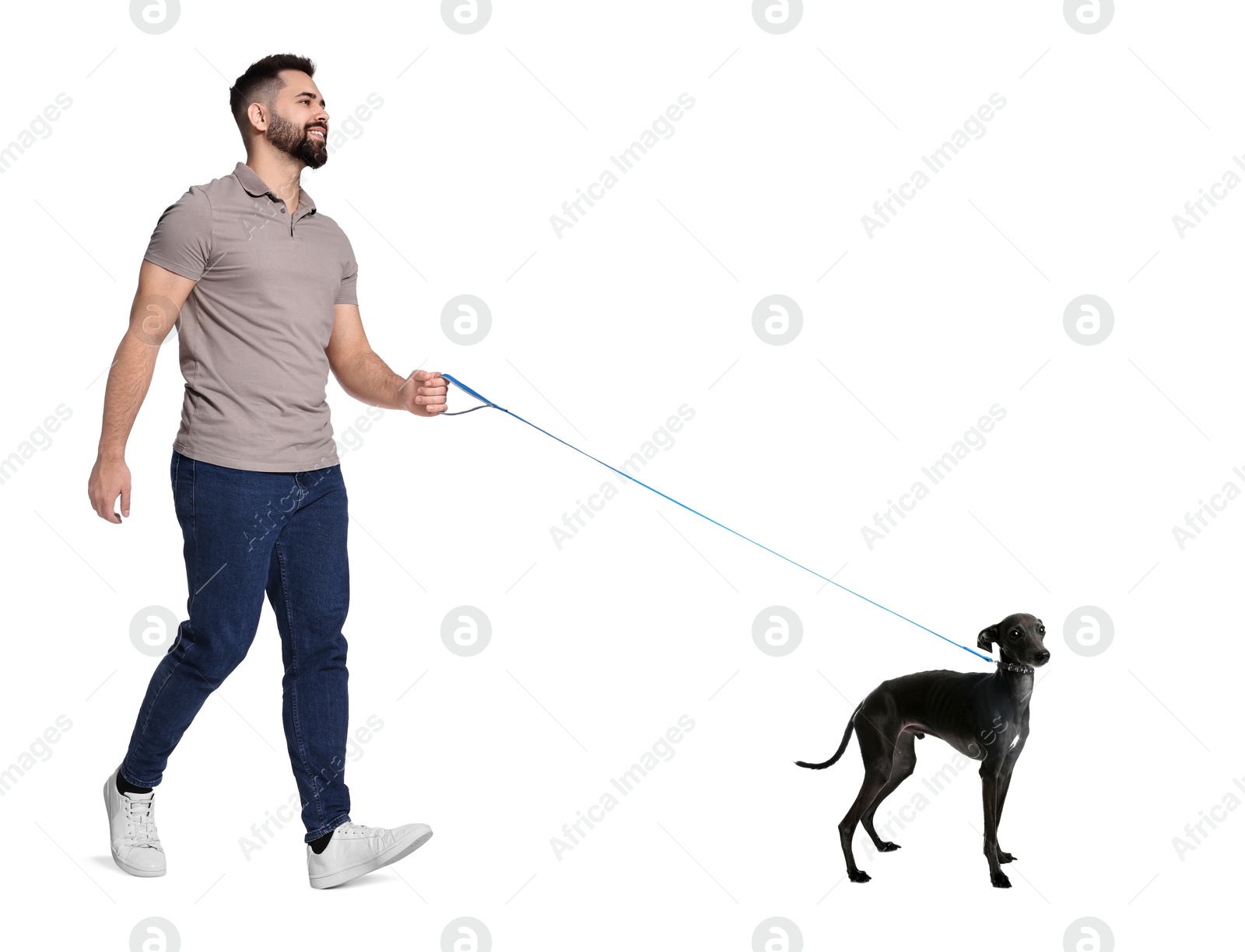 Image of Young man walking his dog on white background