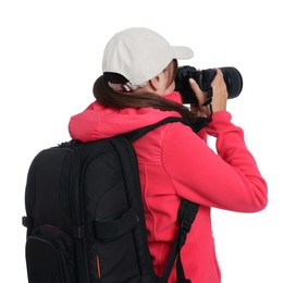 Photo of Photographer with backpack and camera taking picture on white background