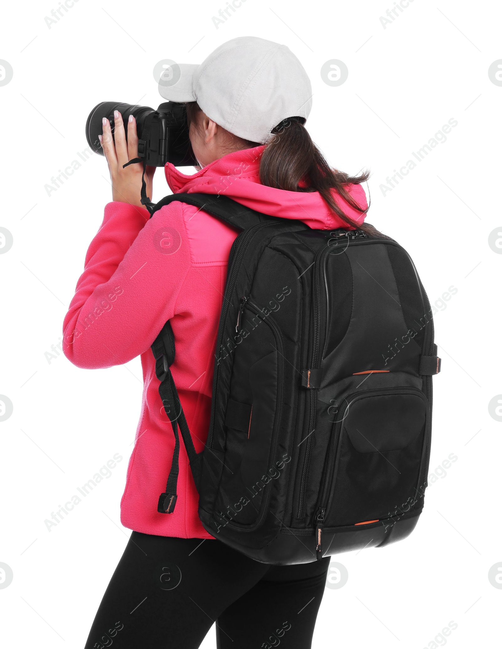 Photo of Photographer with backpack and camera taking picture on white background