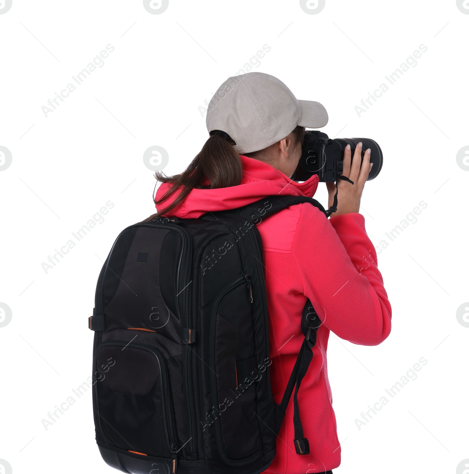 Photo of Photographer with backpack and camera taking picture on white background