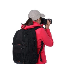 Photographer with backpack and camera taking picture on white background