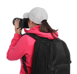 Photo of Photographer with backpack and camera taking picture on white background