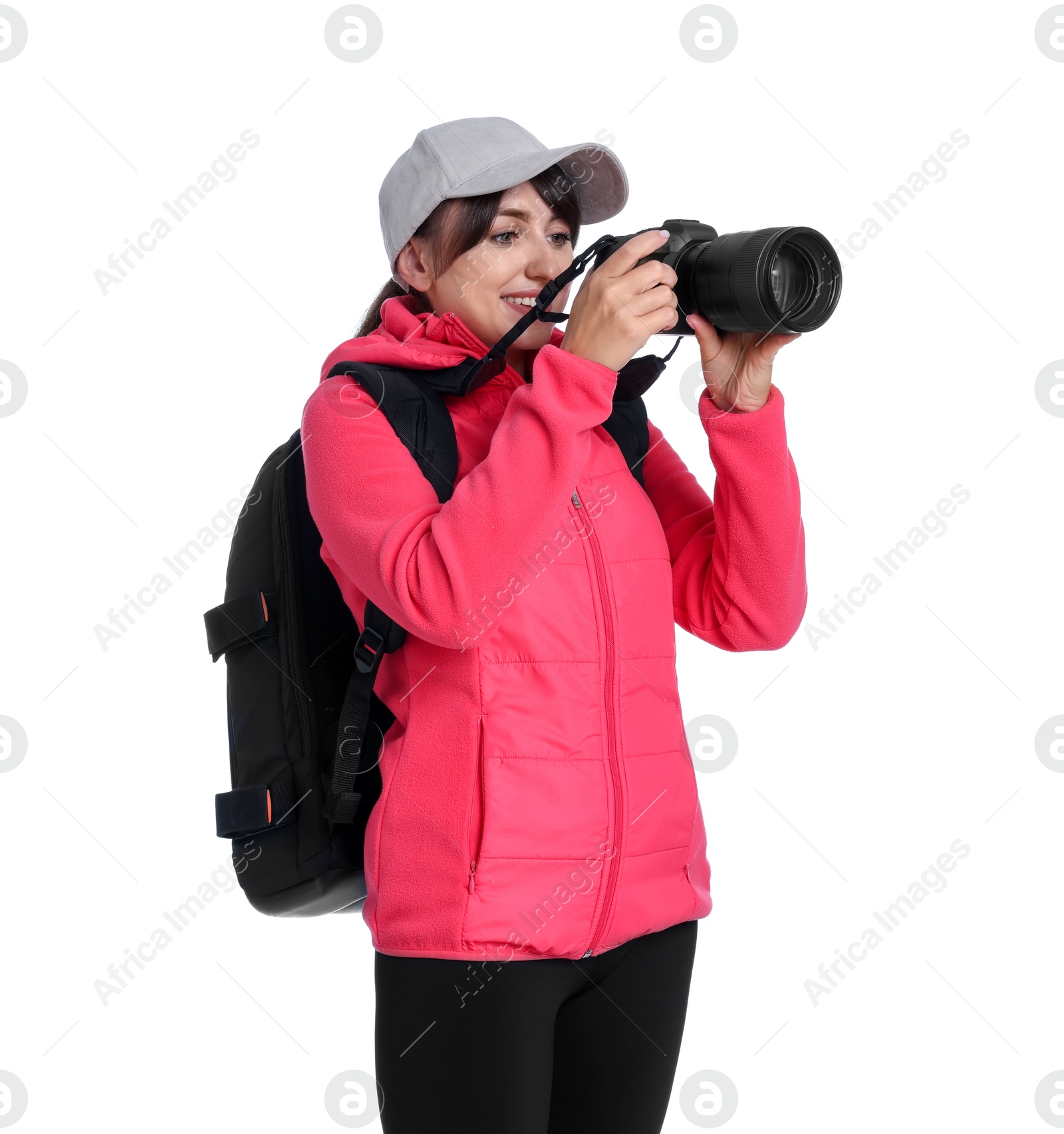 Photo of Photographer with backpack and camera taking picture on white background